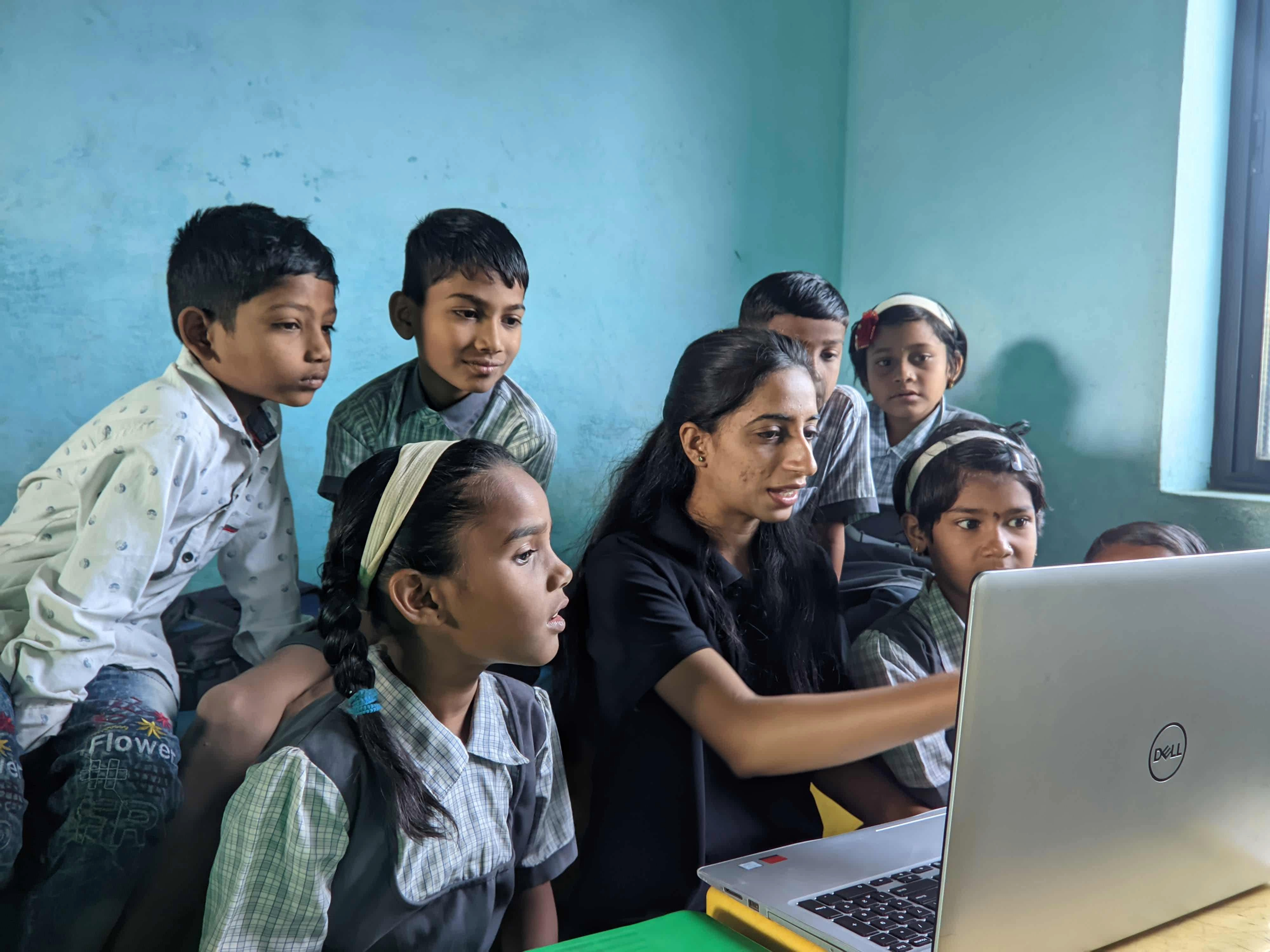 Students showing creativity on computer